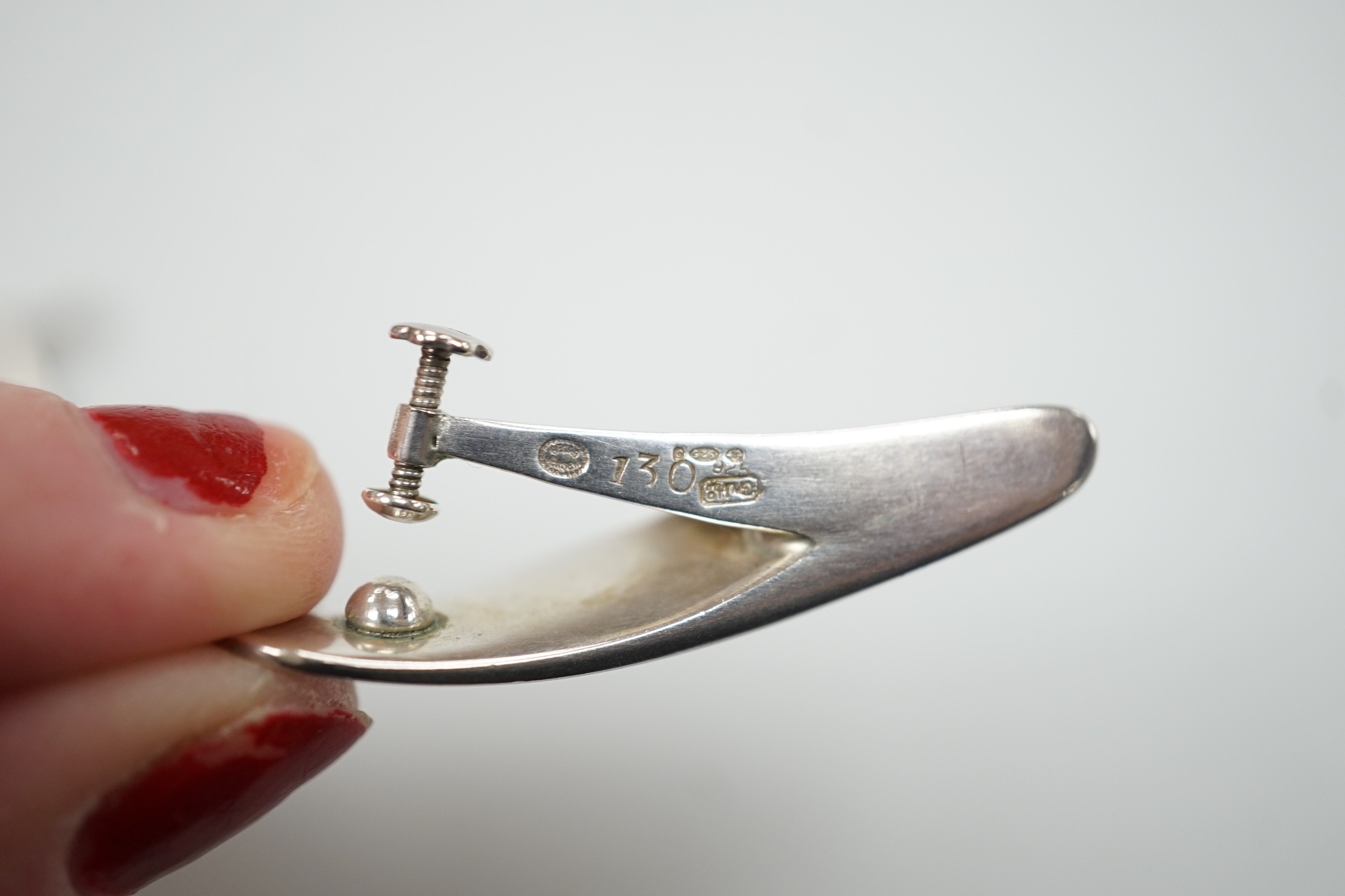 A pair of 1970's silver Georg Jensen curved teardrop shaped ear clips, design no. 130, 40mm.